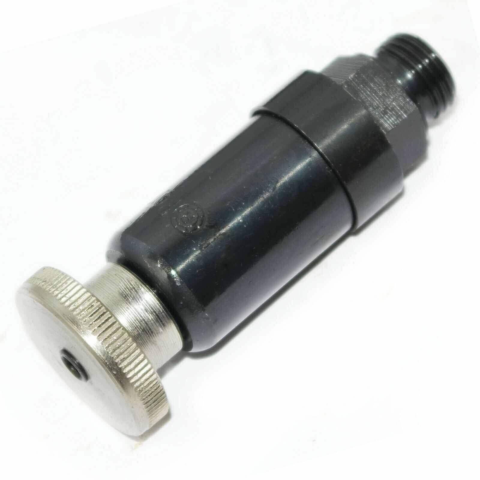 Fuel lift pump, steel construction, compact size, used in tractors for efficient fuel transfer.