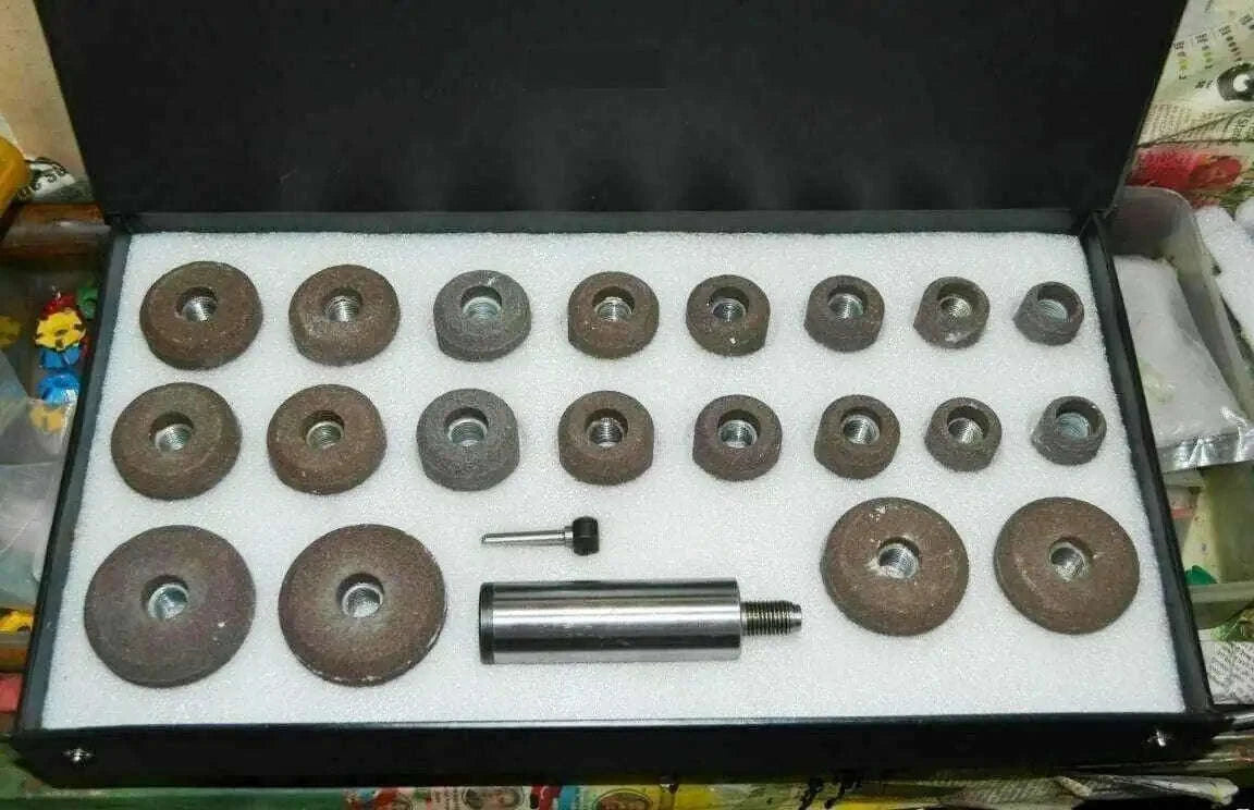 Grey valve seat grinding stones set in case with various sizes for automotive engine repairs