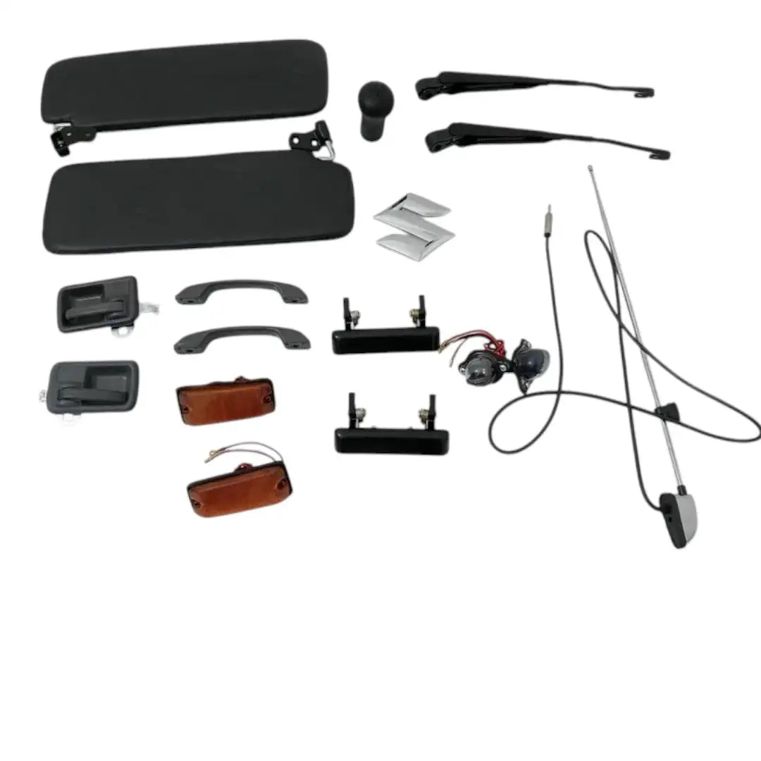Suzuki Samurai SJ410 SJ413 Sierra Gypsy kit with various black plastic parts and accessories, including dials and handles