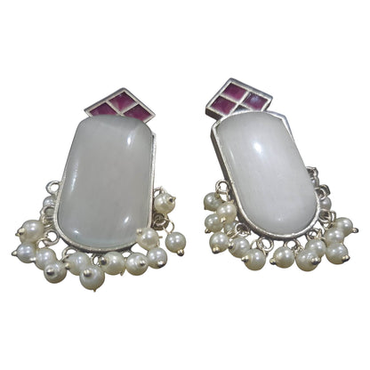 Elegant handcrafted brass drop earrings featuring white stones and pearl embellishments