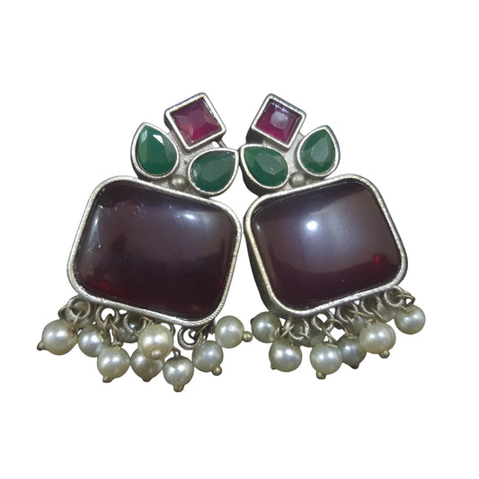 Handcrafted brass drop earrings featuring colorful gemstones and pearl accents for a stylish look