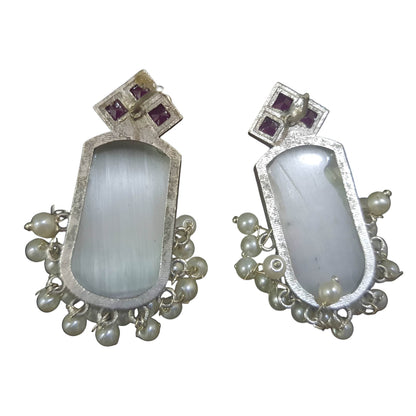 Handcrafted brass drop earrings featuring a unique design with white stones and delicate pearl accents