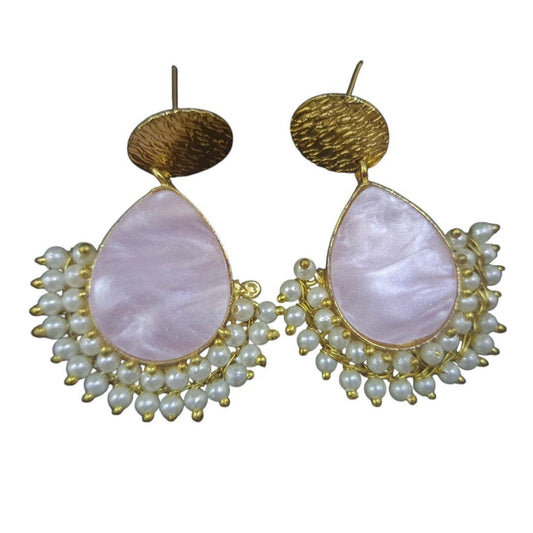 Handcrafted brass pearl earrings with a teardrop design and a cluster of small pearls