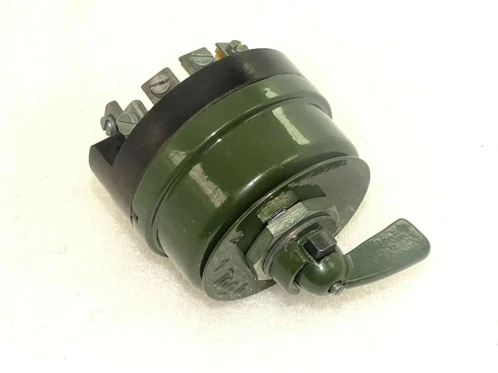 Headlight dimmer switch with green housing and metal terminal posts