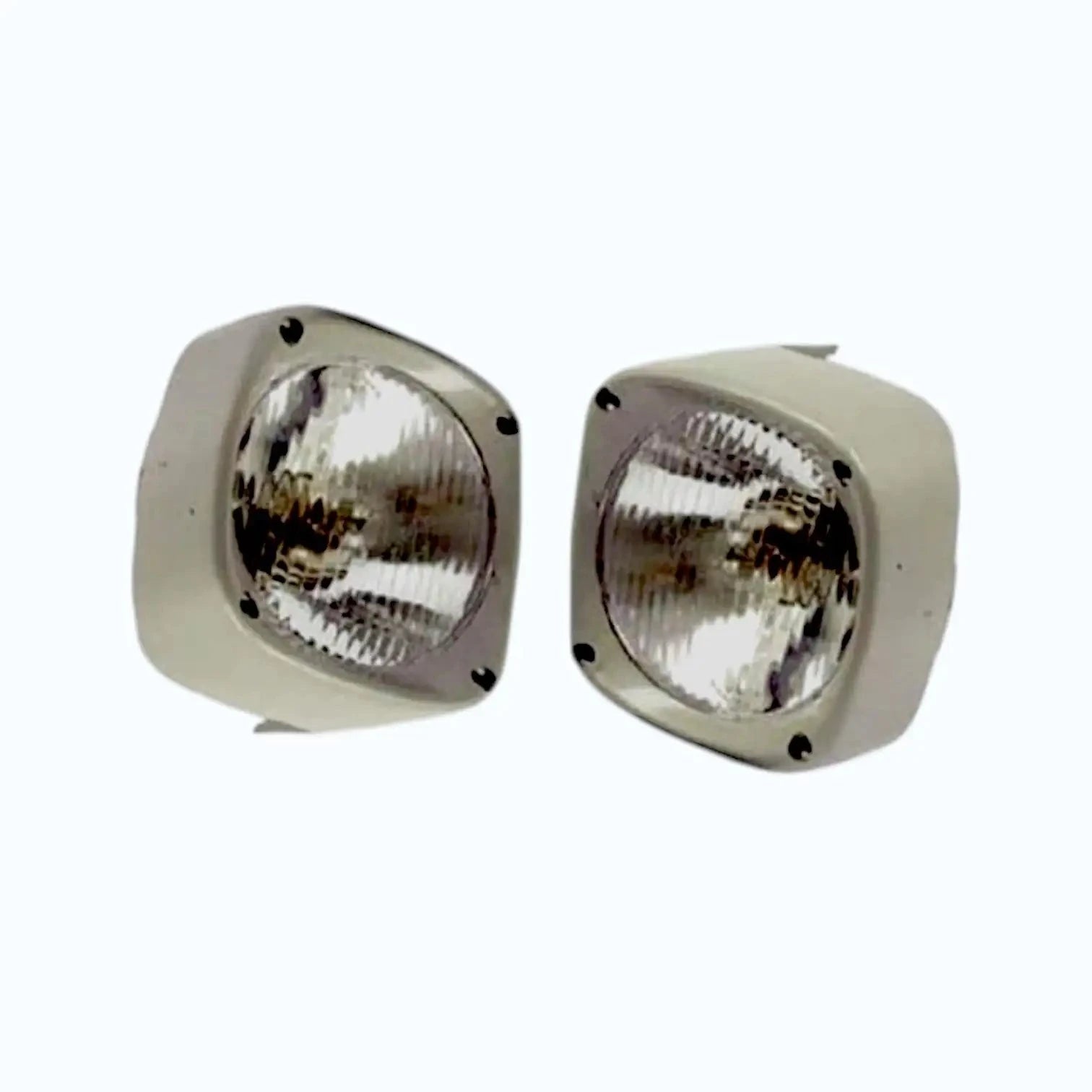 Pair of round tractor headlight lamps with clear glass and beige mounting housings