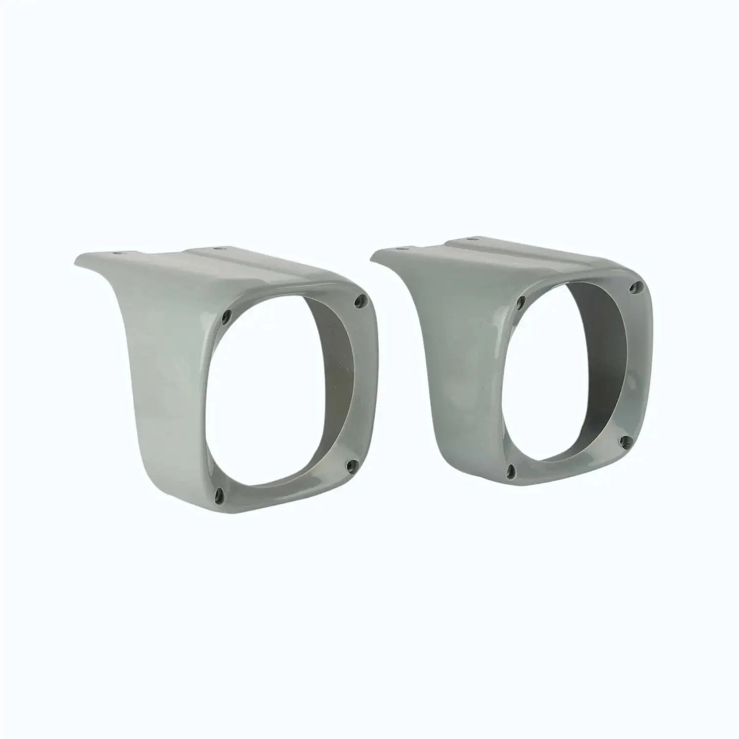 Pair of tractor headlight cowls with round openings and mounting screw holes