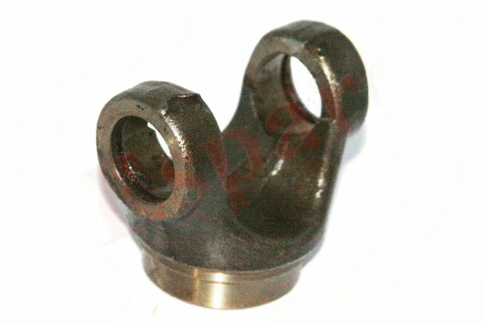 Forked transmission half yoke, dark metal with circular bore, bronze edge