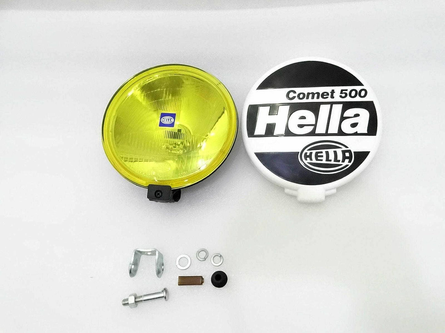 Hella Black Magic Comet 500 driving lamp kit with yellow lens, mounting hardware, and durable fittings.