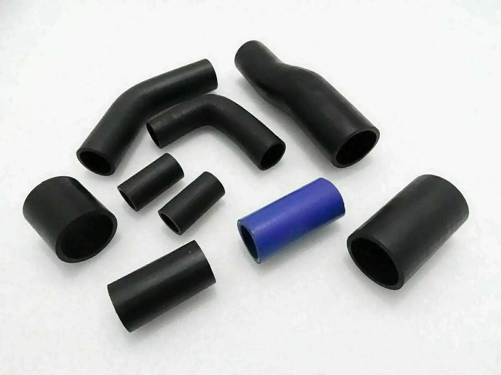 Hose pipe kit with multiple black rubber elbows and a blue coupling