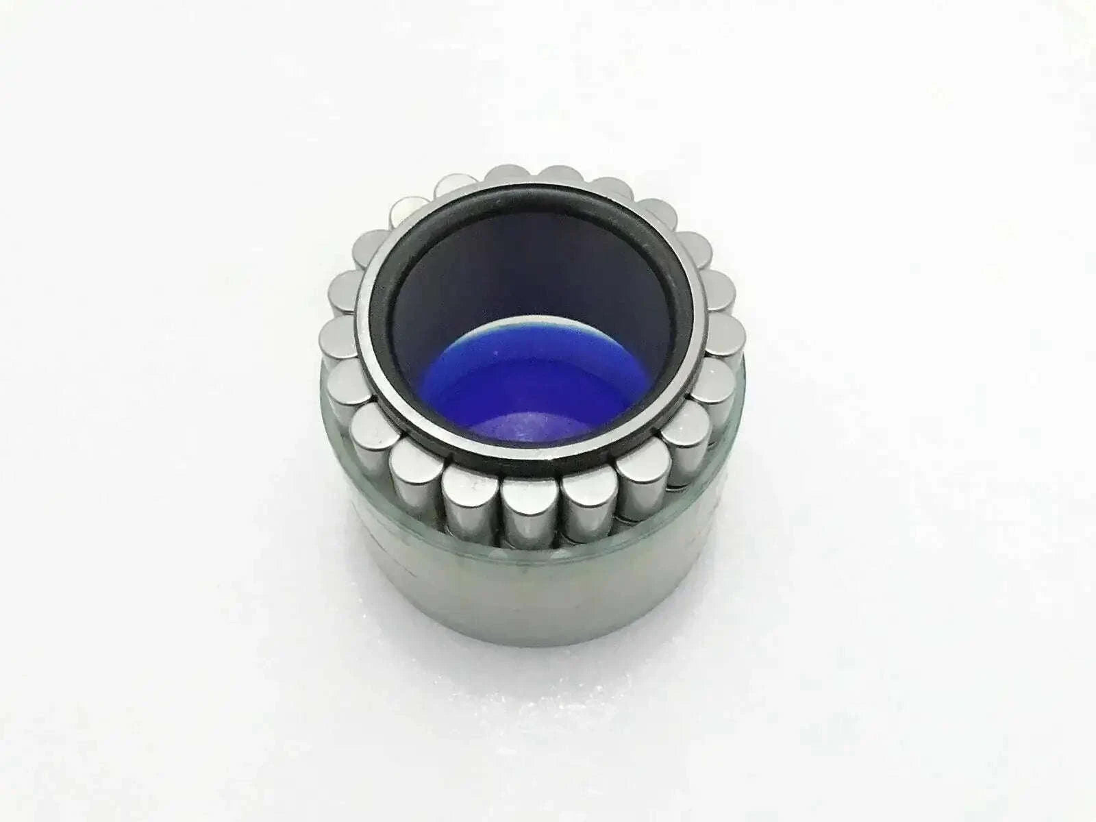 Jcb hub roller bearing with exposed rollers and blue inner grease