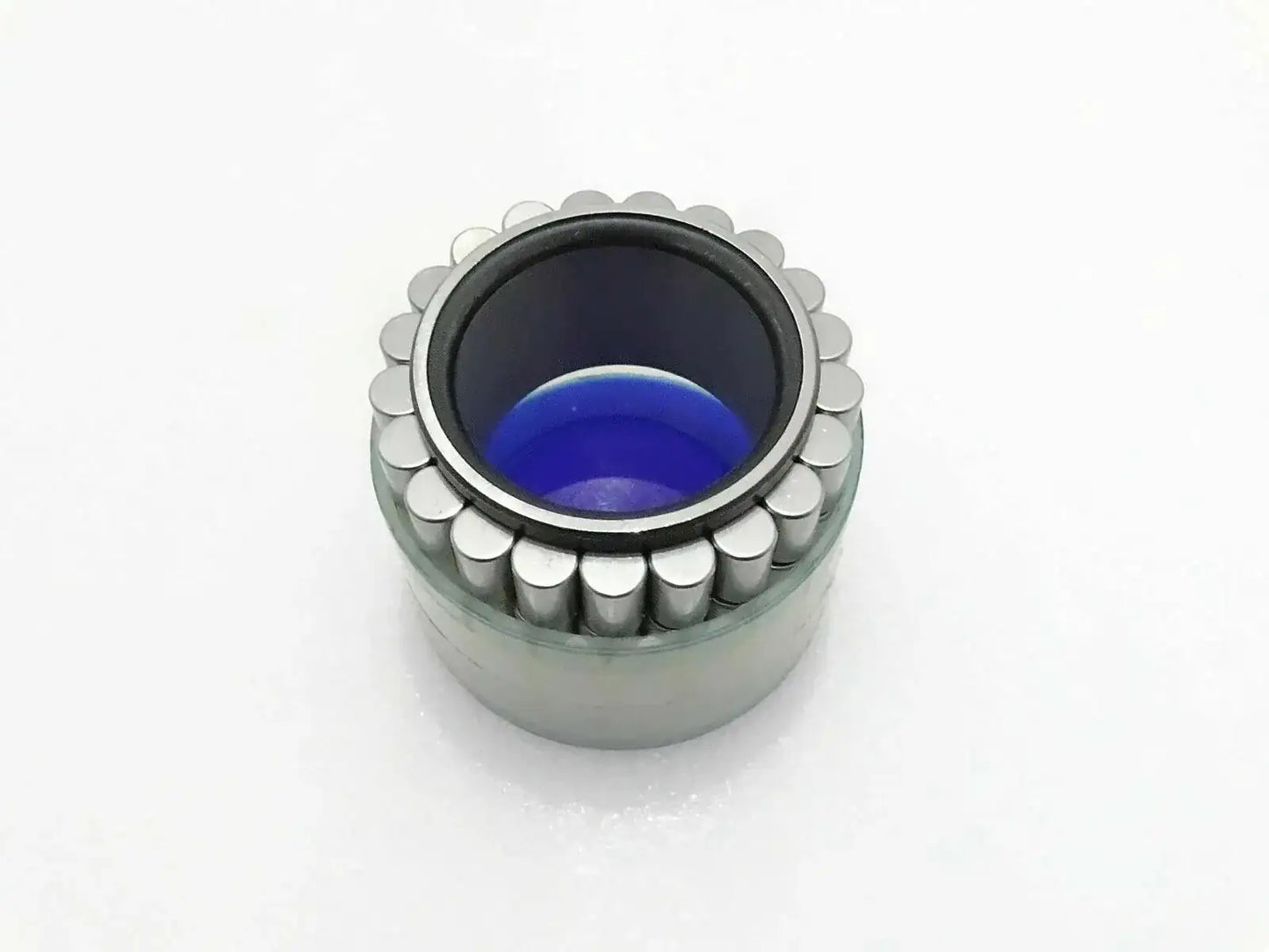 Jcb hub roller bearing with exposed rollers and blue inner grease