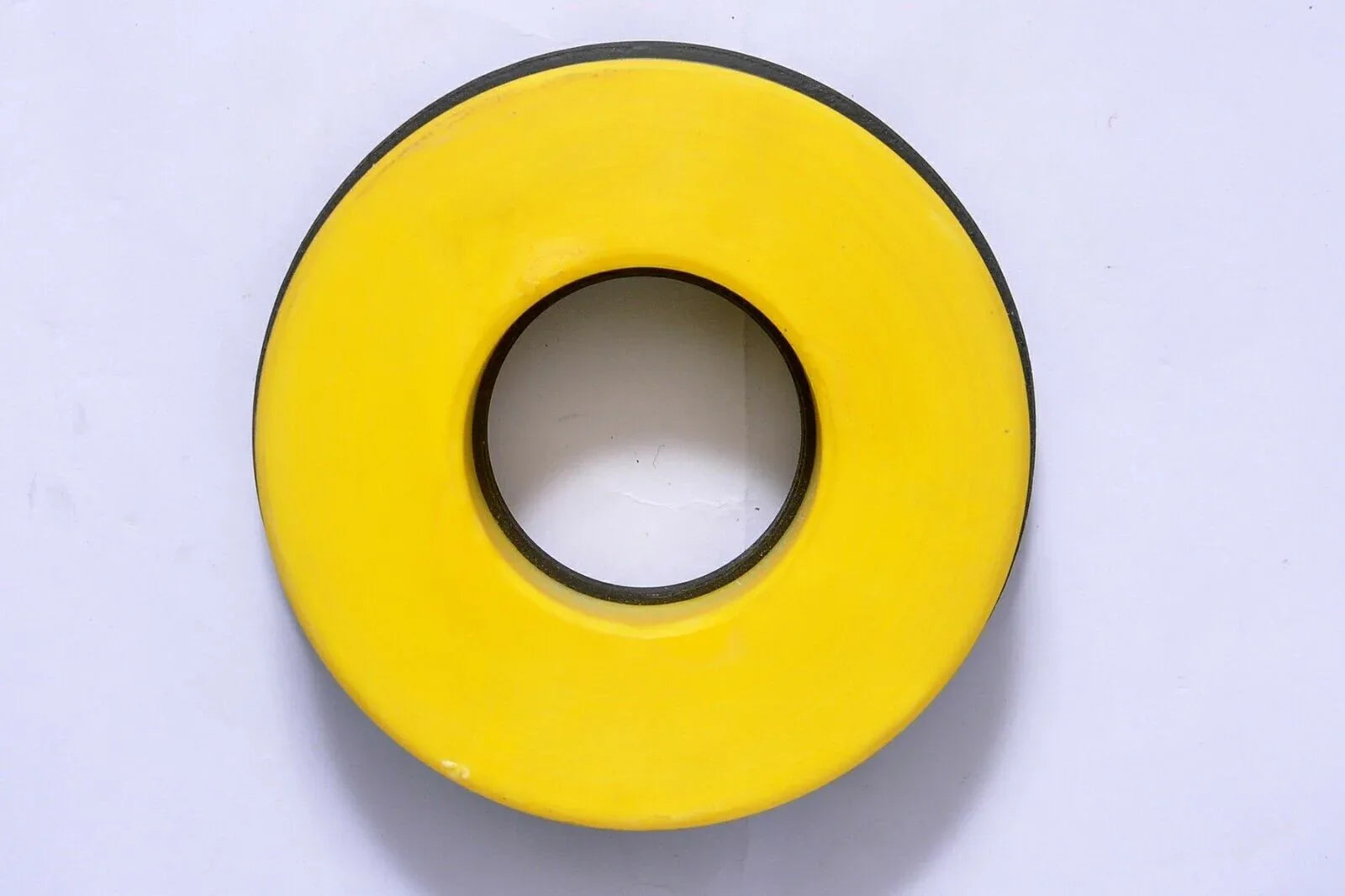 Yellow circular hydraulic clamp seal with center hole