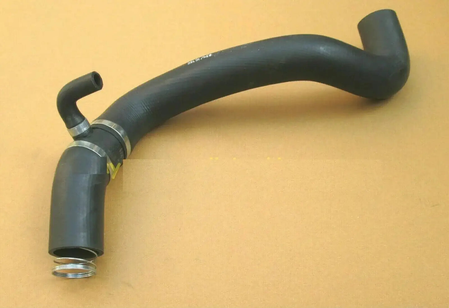 Hydraulic oil suction hose with metal couplings and bent rubber tubing