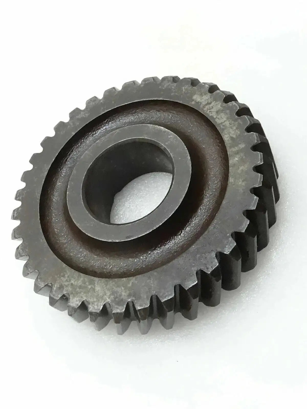 Dark steel gear idler sprocket with central bore