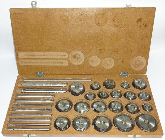 Face cutter set in open wooden case with multiple metal cutting tools