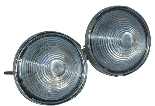 Pair of round parking/turn signal lights, ribbed clear lenses, chrome bezels