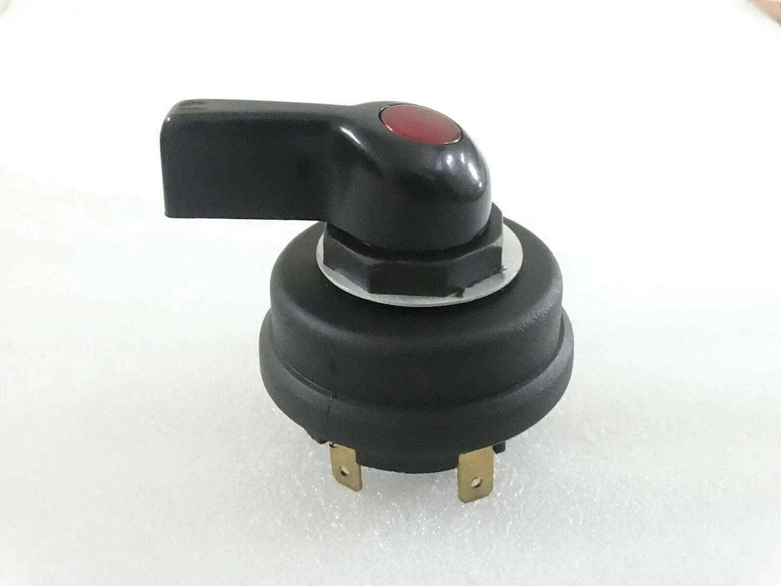 Black indicator blinker switch with red button and two electrical terminals