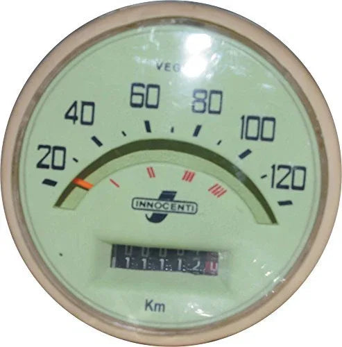 Speedometer/tachometer gauge with green face, chrome bezel, km markings and needle