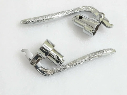 Polished chrome interior door levers with decorative design, perfect for modern home doors