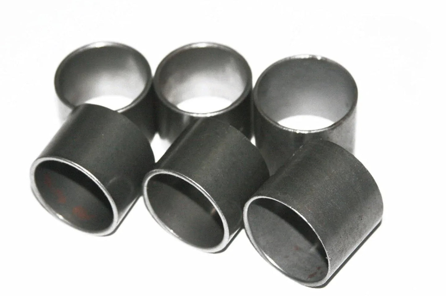 Set of six front fork bushings, dark metal cylindrical sleeves