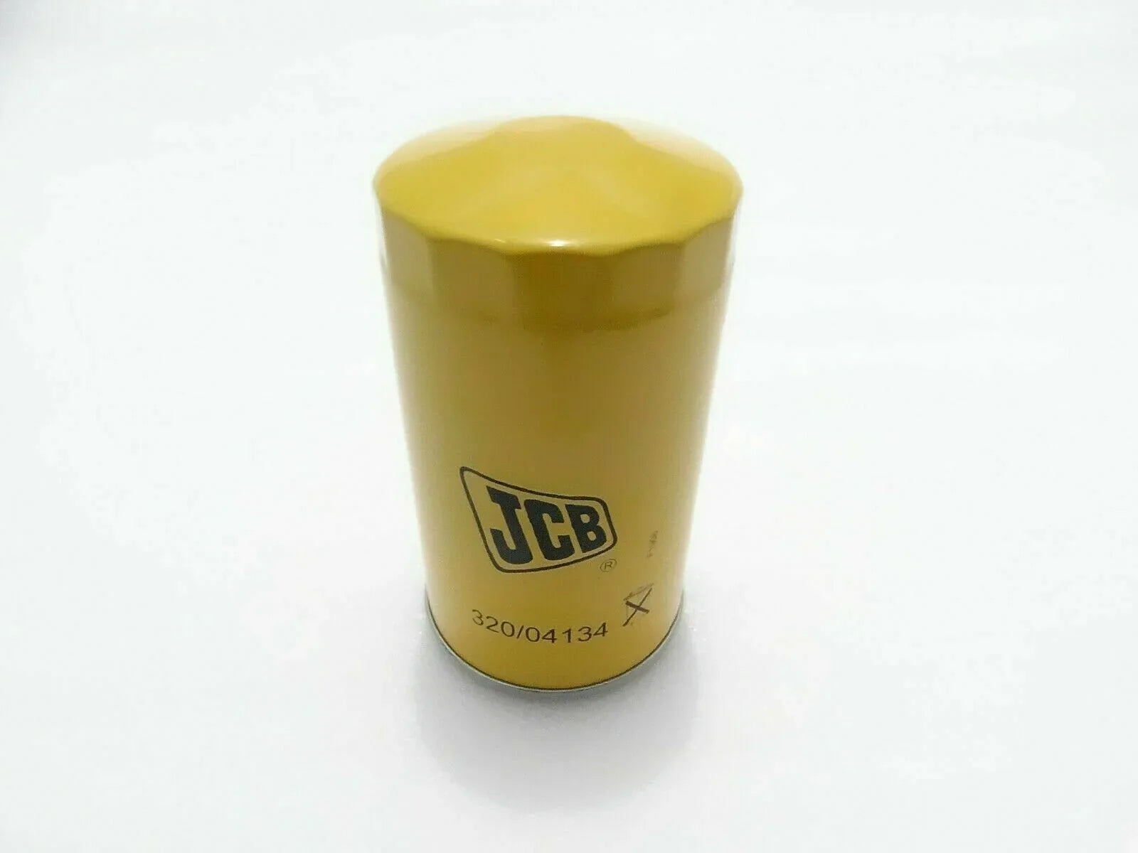 Yellow JCB oil filter canister with printed part number 320/04134