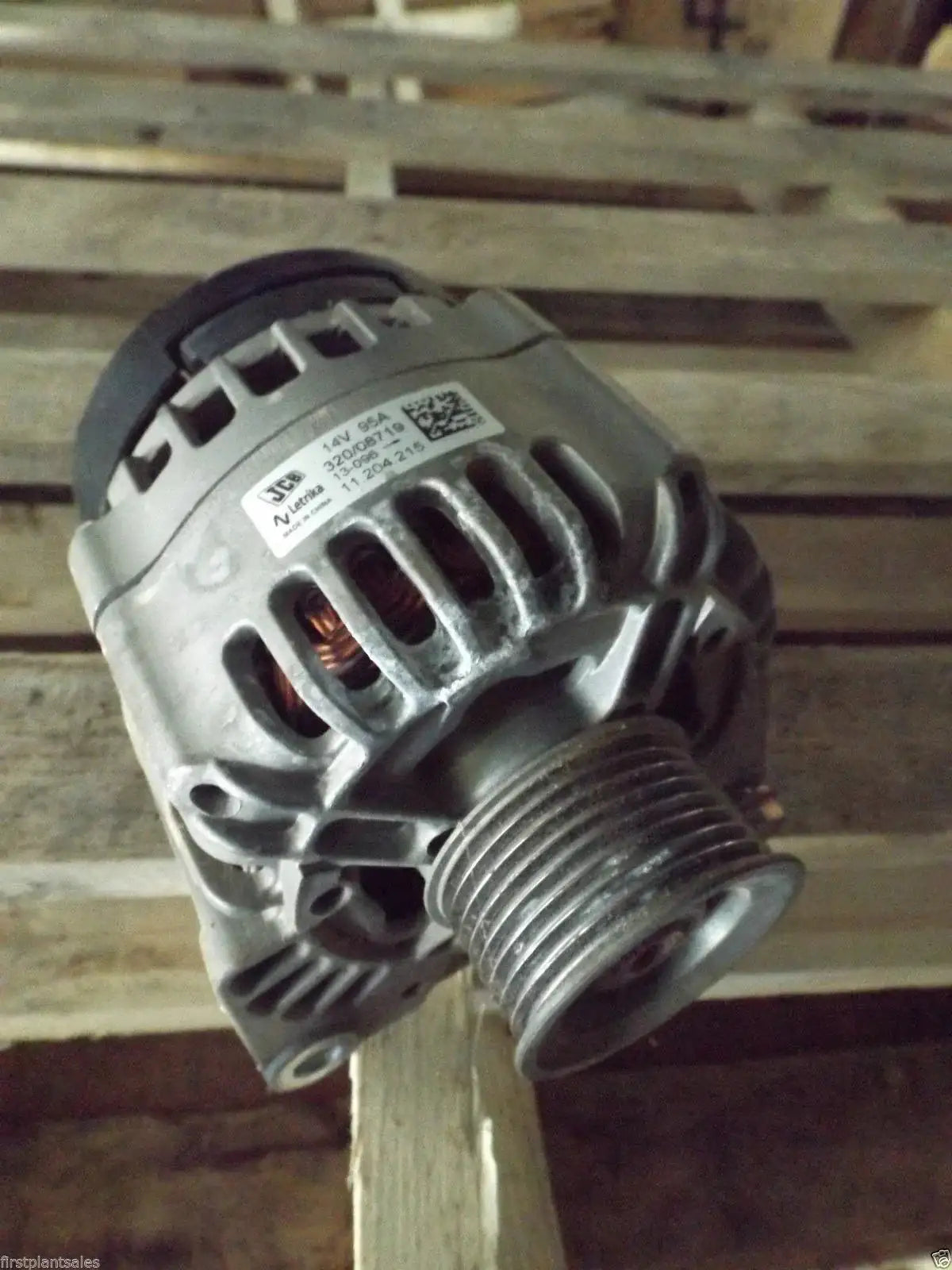 Metal alternator with vented body and threaded pulley, front view