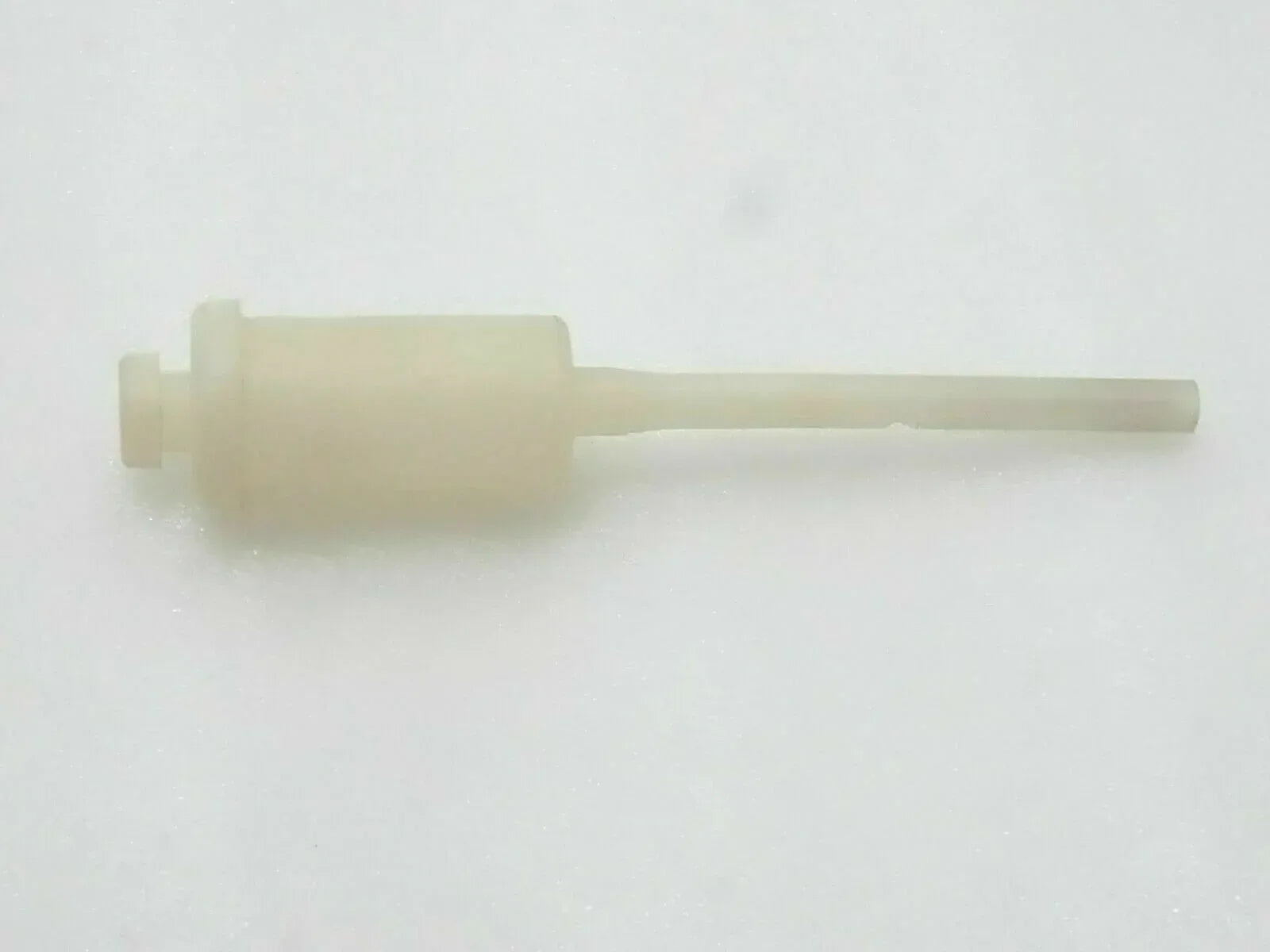 Axle breather tube with light beige plastic body and extended nozzle
