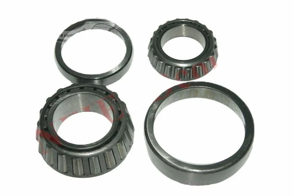 Front wheel bearing kit set with four metal bearing rings and roller assemblies