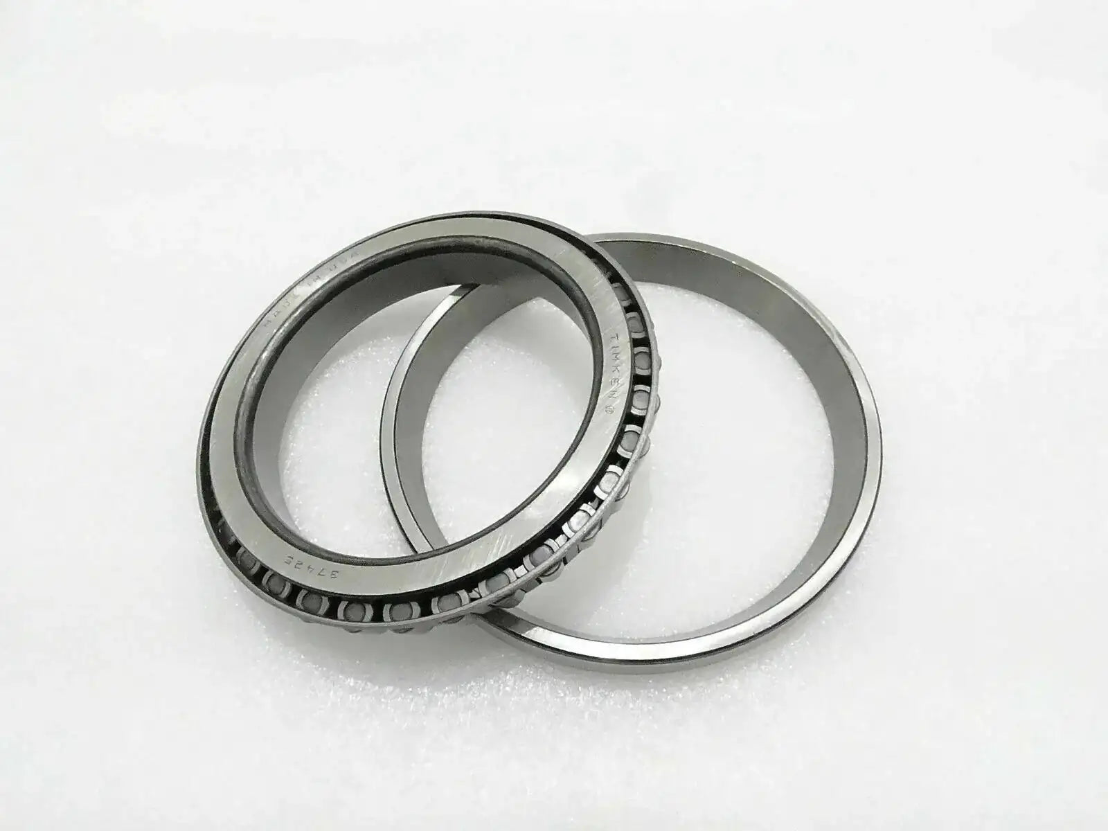 Hub bearing roller set with two metal rings