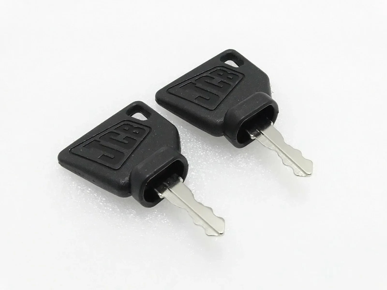Pair of black ignition keys with metal blades