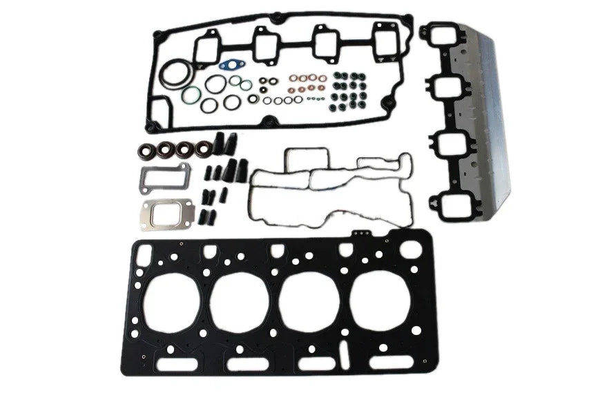 Engine top gasket kit with multiple metal gaskets and seals