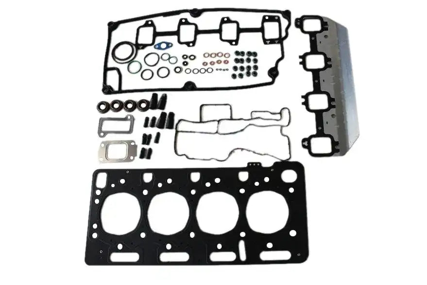 Engine top gasket kit with multiple metal gaskets and seals