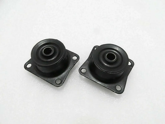 Pair of black rubber mounts with metal plates, mounting holes, and central eyelets