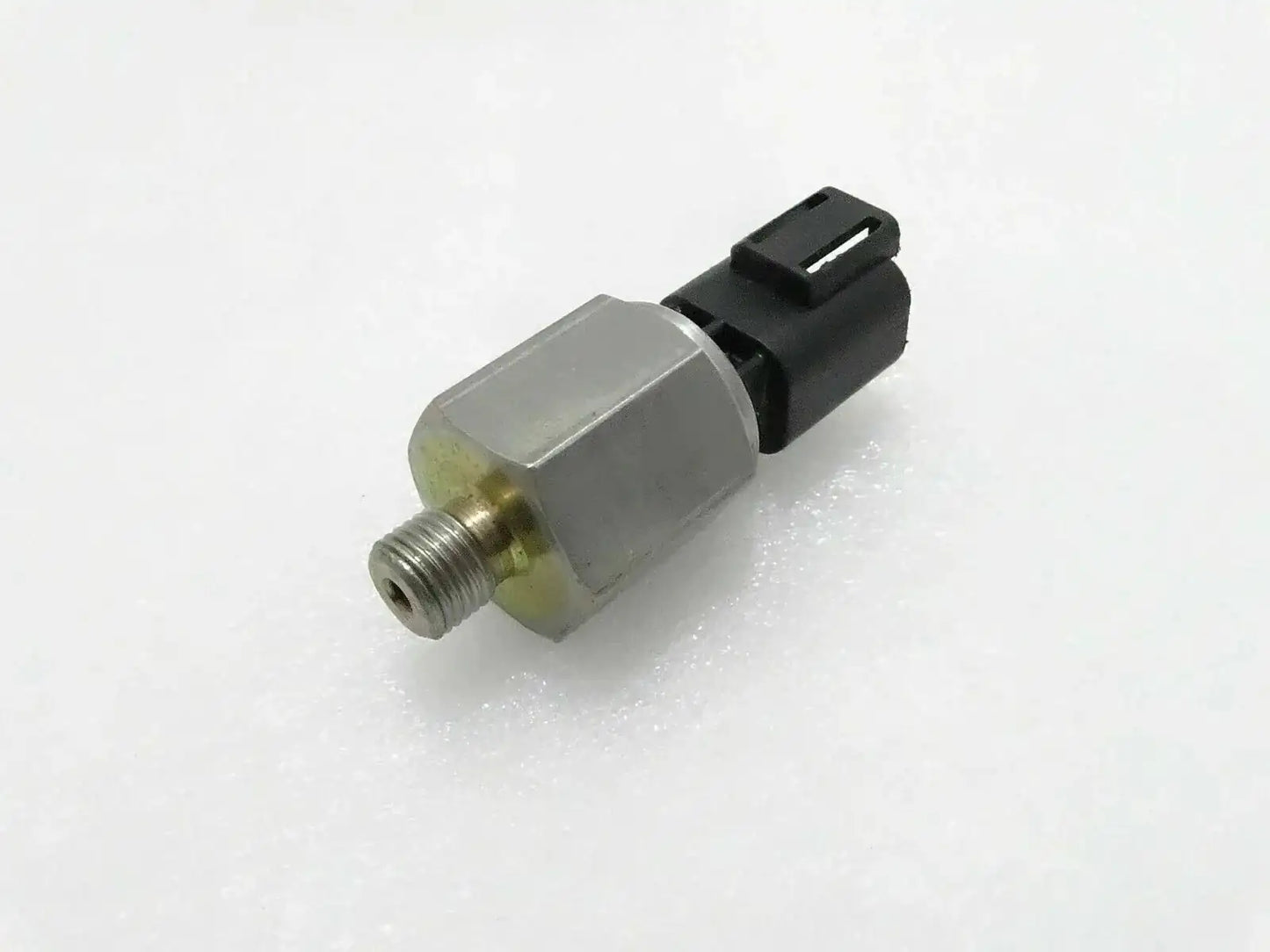 JCB 3CX oil pressure switch, stainless steel, compact size, essential for engine oil monitoring