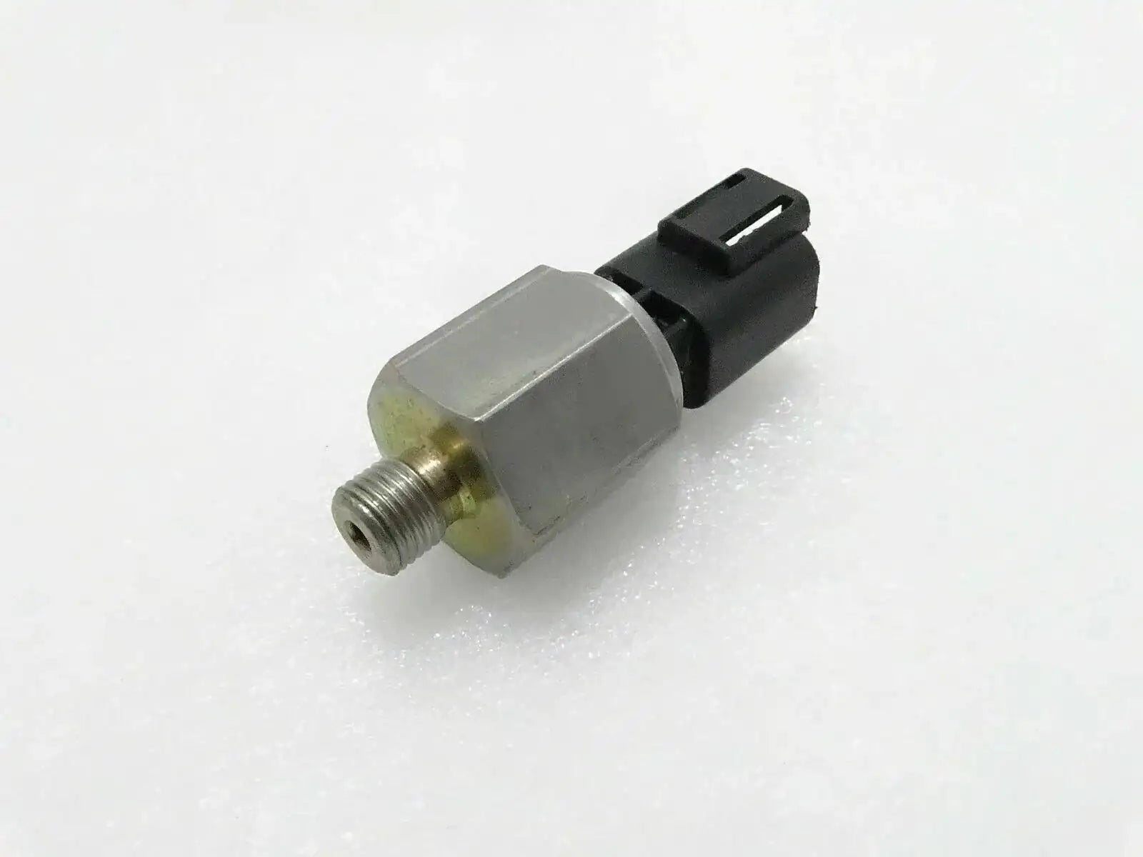 JCB 3CX oil pressure switch, stainless steel, compact size, essential for engine oil monitoring