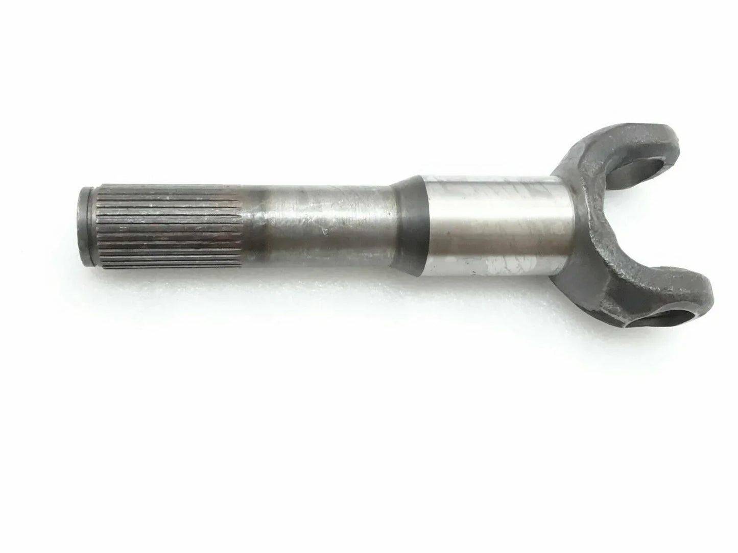 Steel shaft hub side yoke with splined shaft end and forked connector