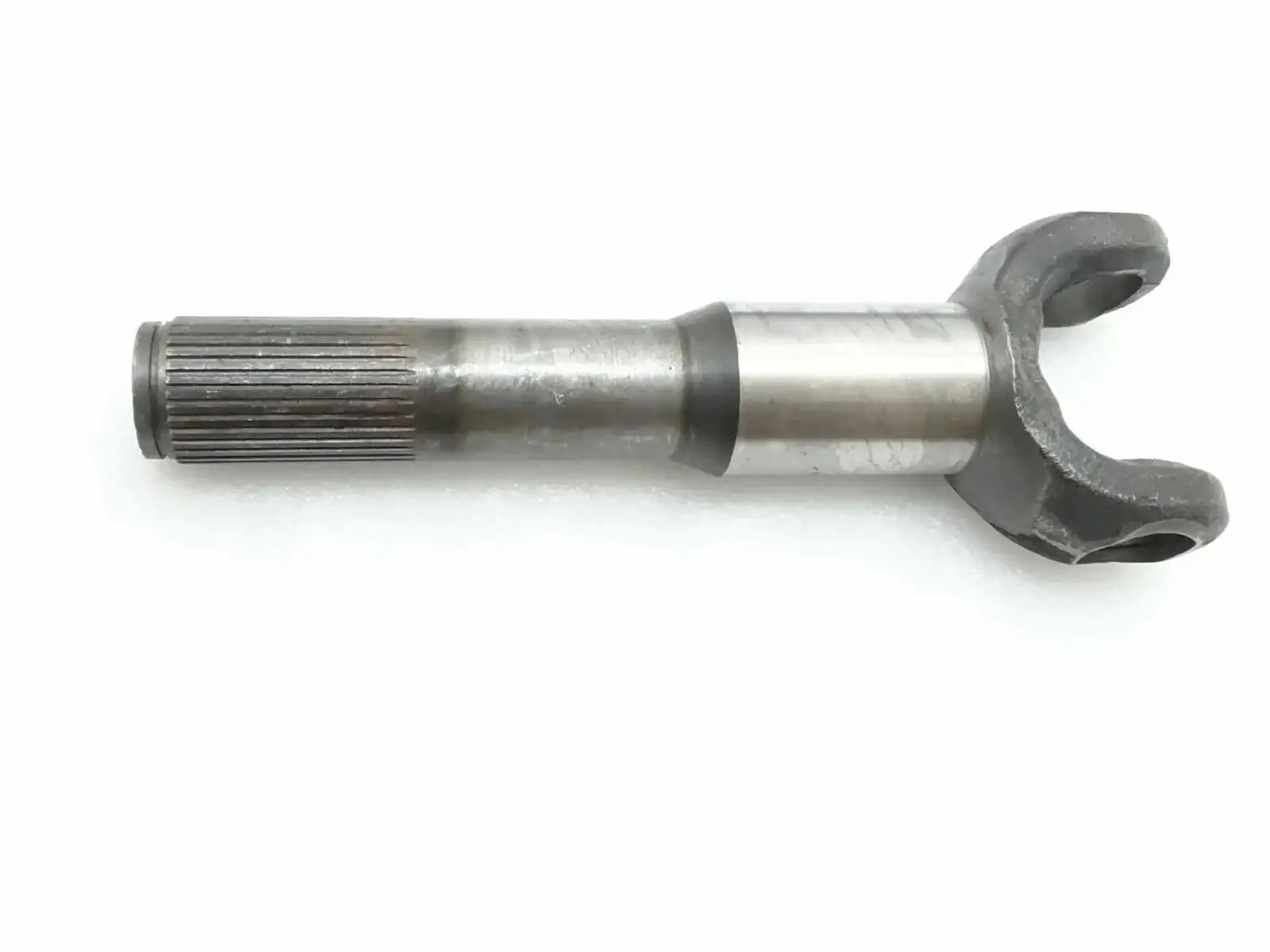 Steel shaft hub side yoke with splined shaft end and forked connector