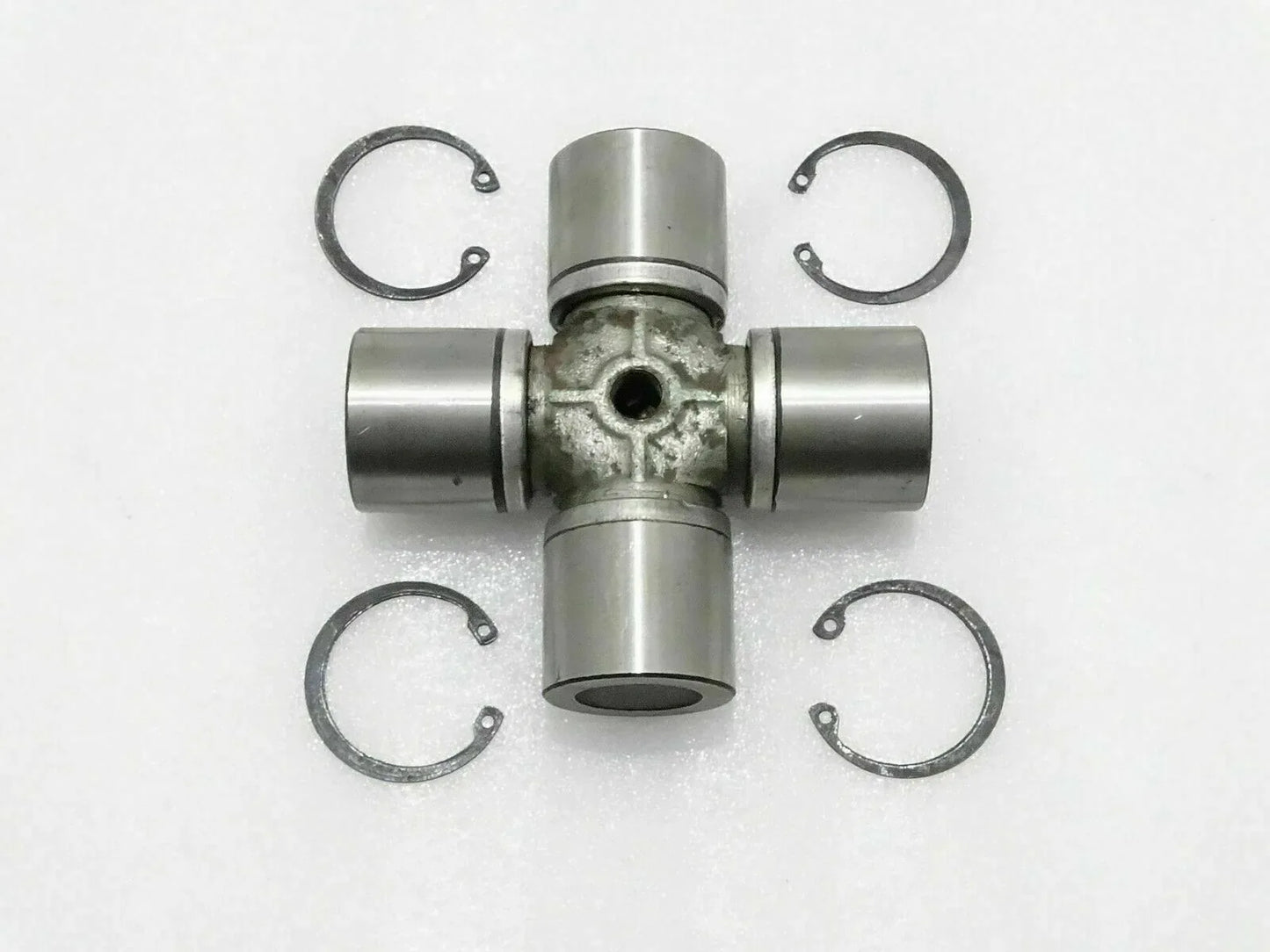 JCB 3CX universal joint replacement, steel, 4-way joint with circlips for heavy machinery applications