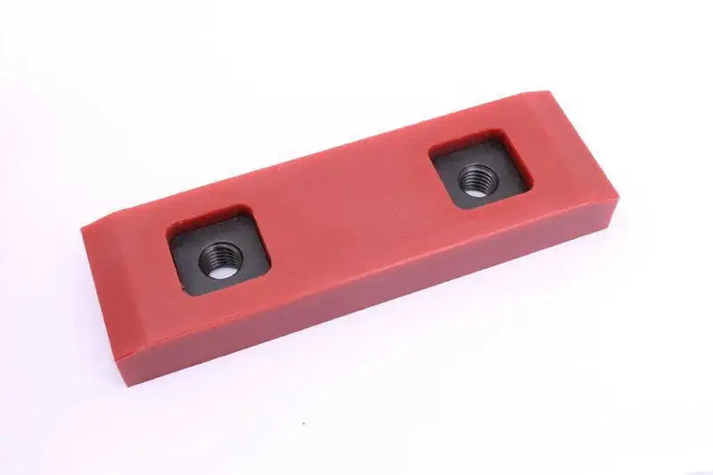 Red wear pad block with two threaded mounting holes