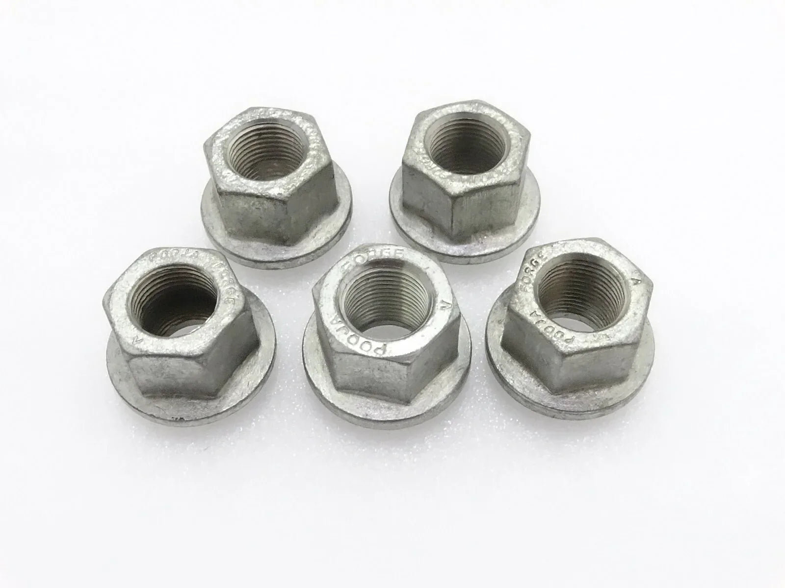 Set of five silver metal hex wheel nuts with threaded bores