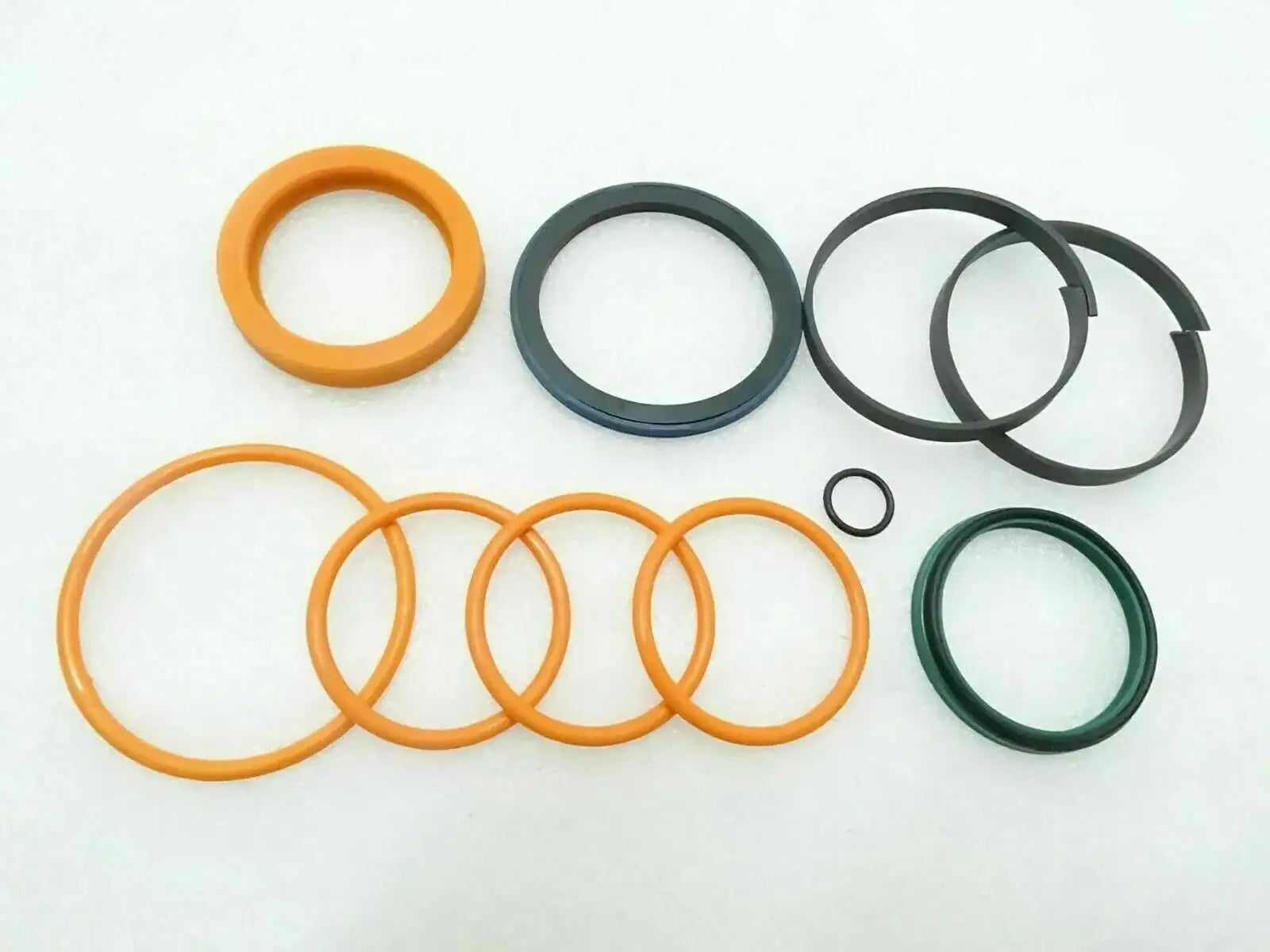Hydraulic seal kit with orange and green O-ring seals and washers