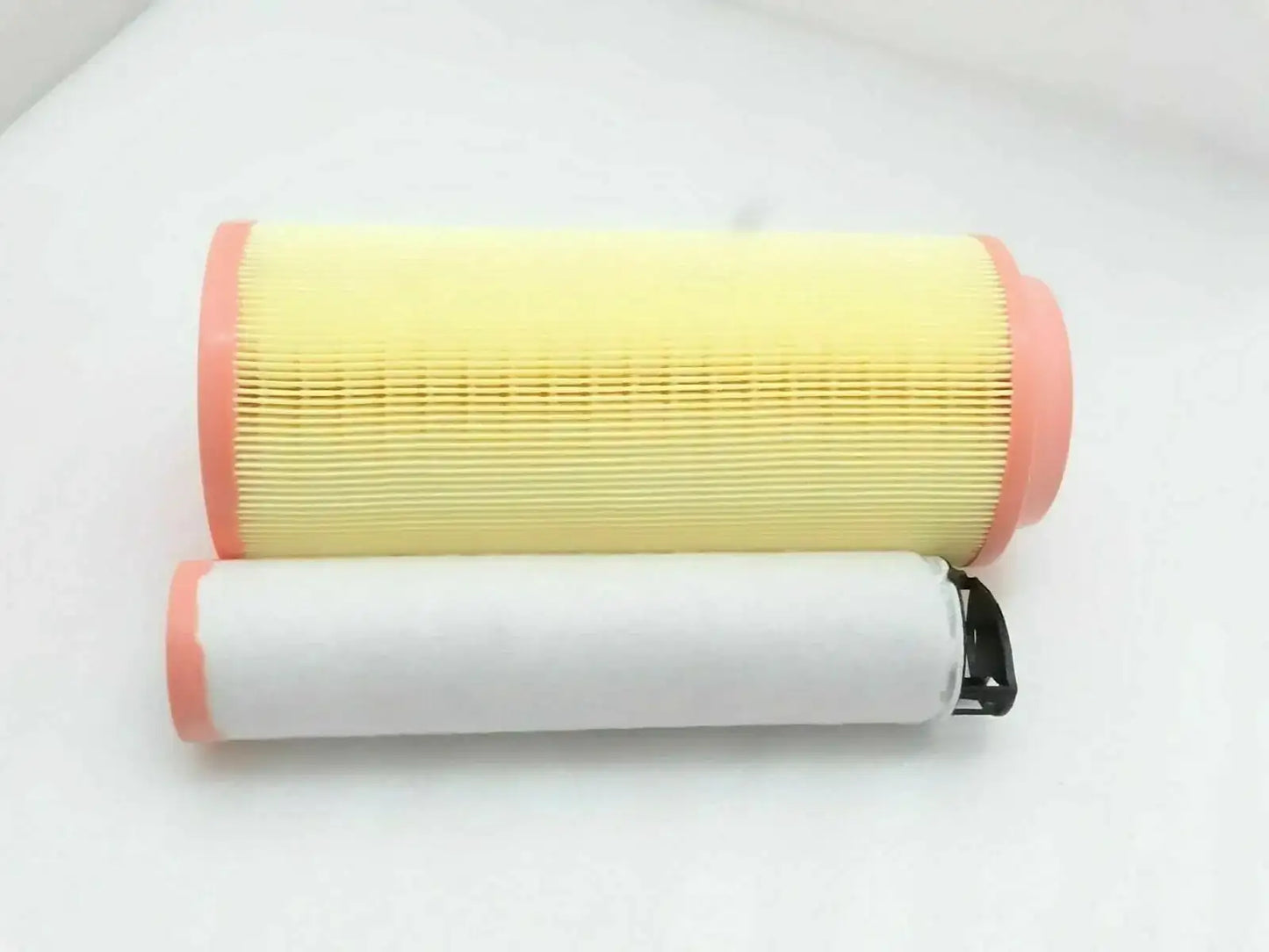 Air filter element with pleated yellow filter media and red end caps