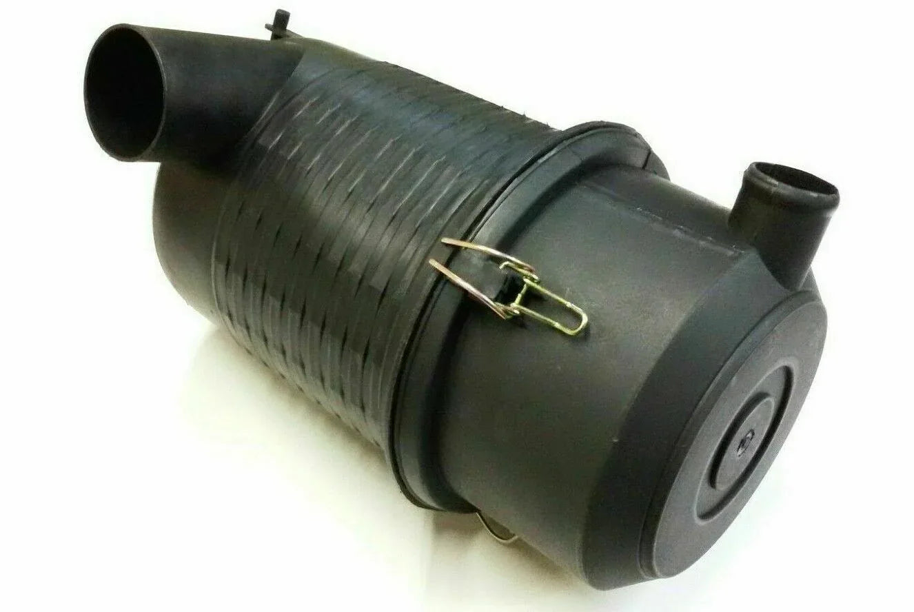 Air filter housing, dark cylindrical with hose inlet and metal clamp