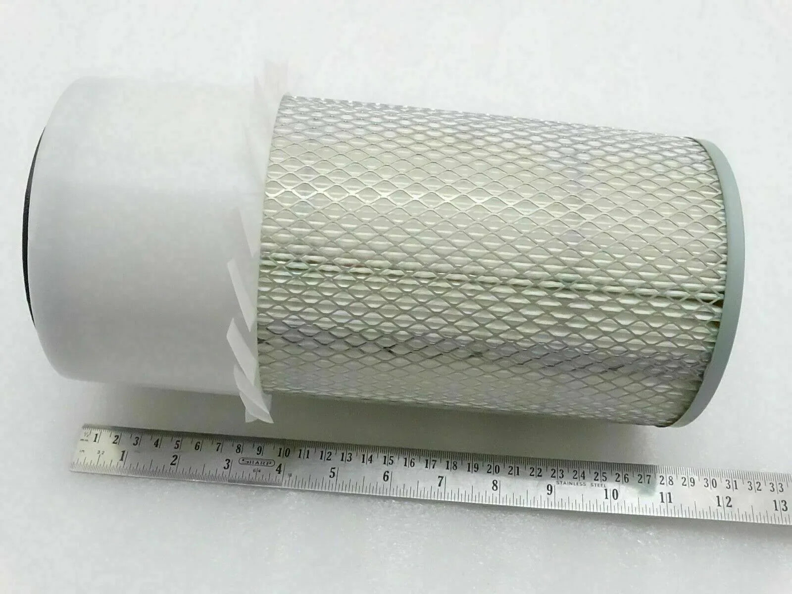 Cylindrical pleated air filter element with wire mesh, end caps