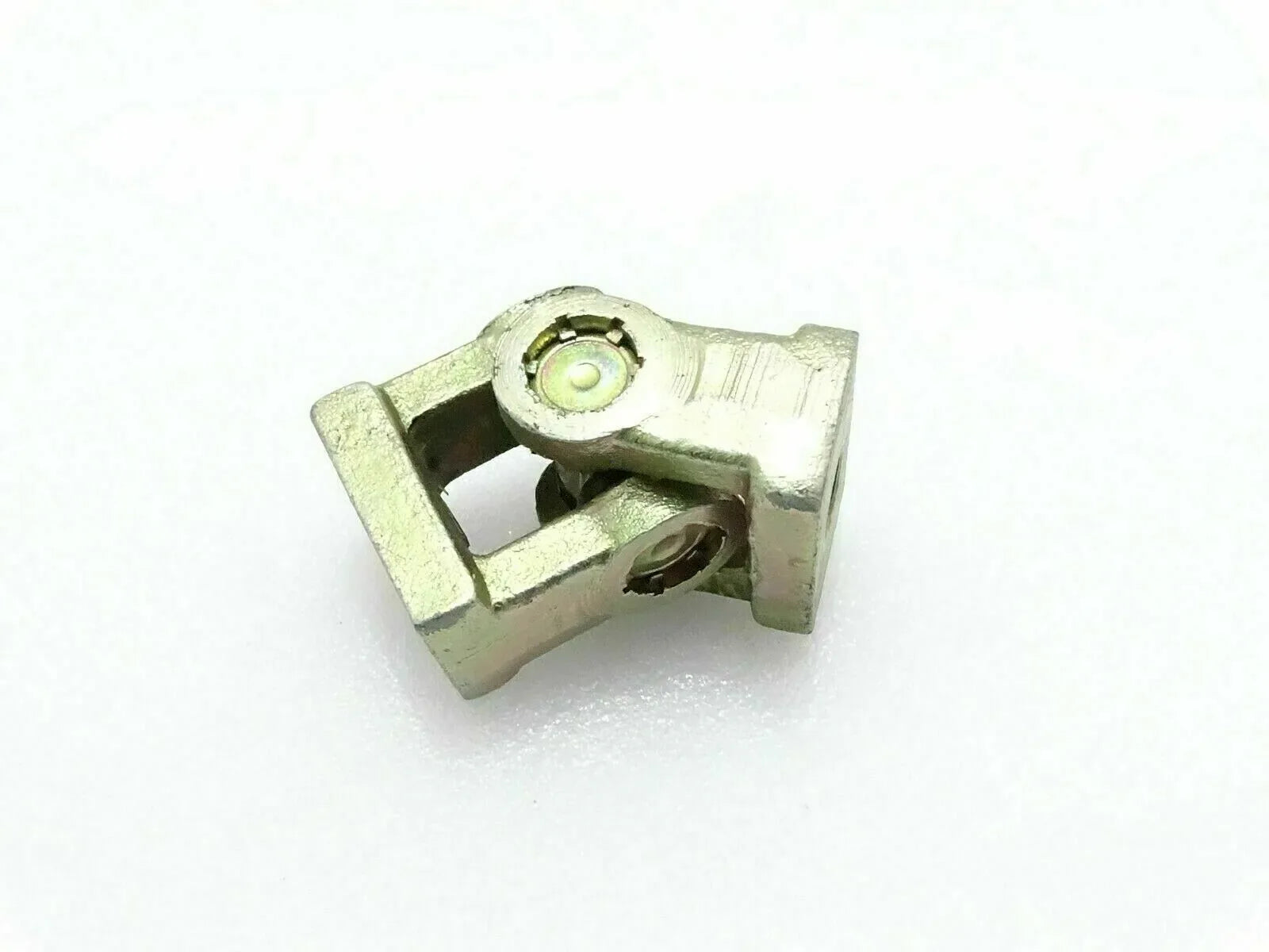 Universal joint yoke connector with greased bearing and mounting bolt