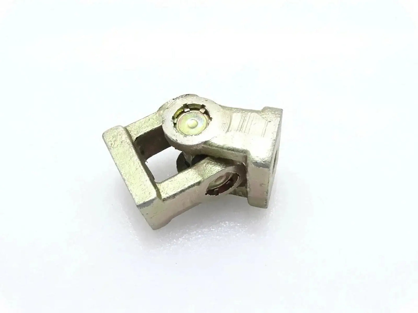 Universal joint yoke with grease fitting, metal housing, for backhoe linkage