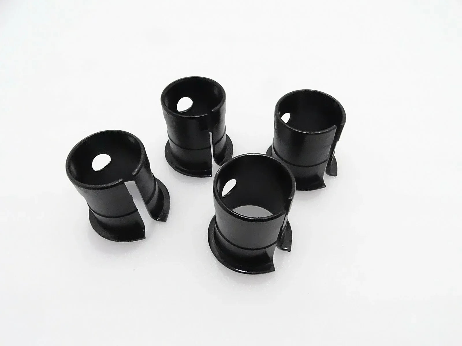 JCB bucket bush replacement, 4-piece set, durable steel, designed for heavy machinery use