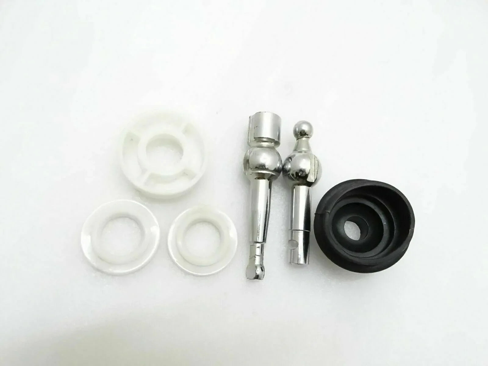 Gear lever assembly kit with metal rods, rubber boot, and white plastic seals