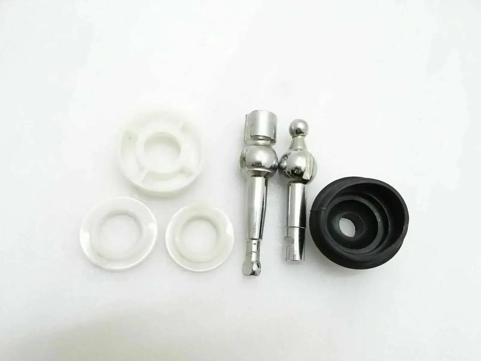 Gear lever assembly kit with metal rods, rubber boot, and white plastic seals
