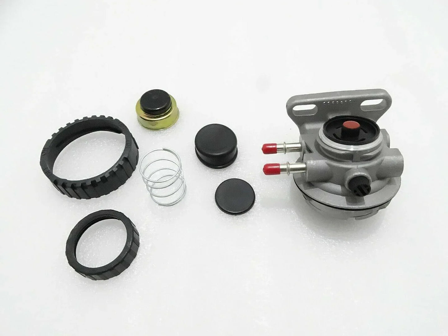 Hand primer kit components with pump head, fittings, rings, and spring